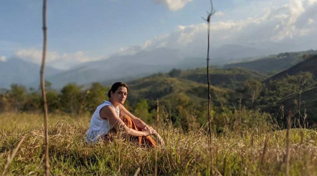 maria perrine sitting in the fields
