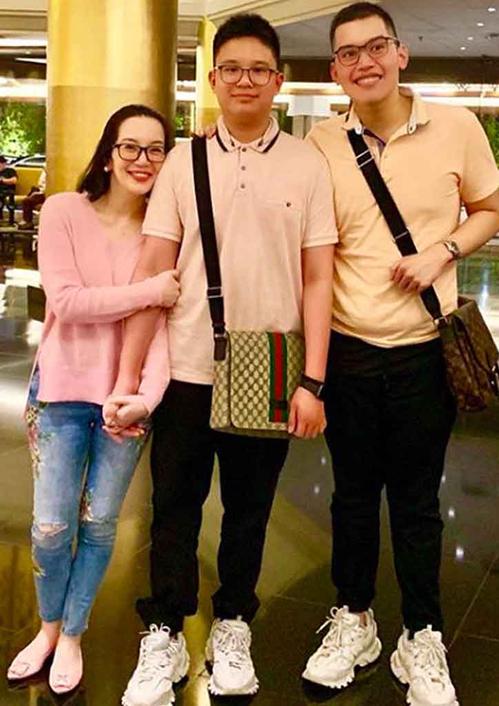 lady in pink with her two sons