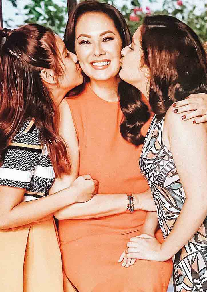 daughters kissing parent