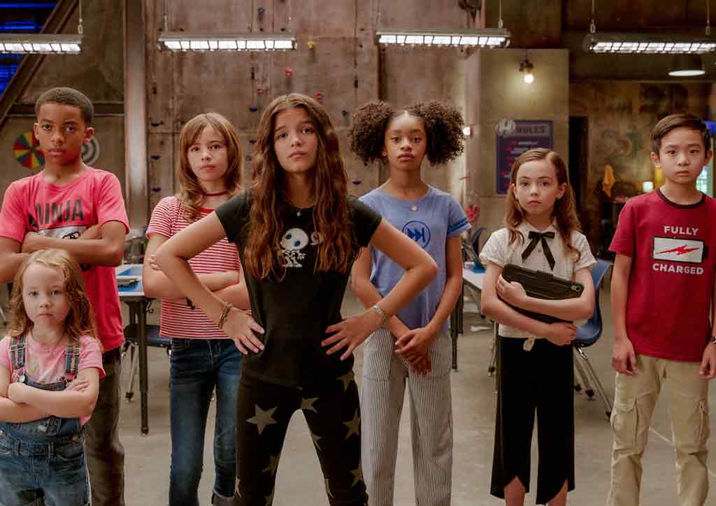 We can be heroes summer movie with children looking at camera 