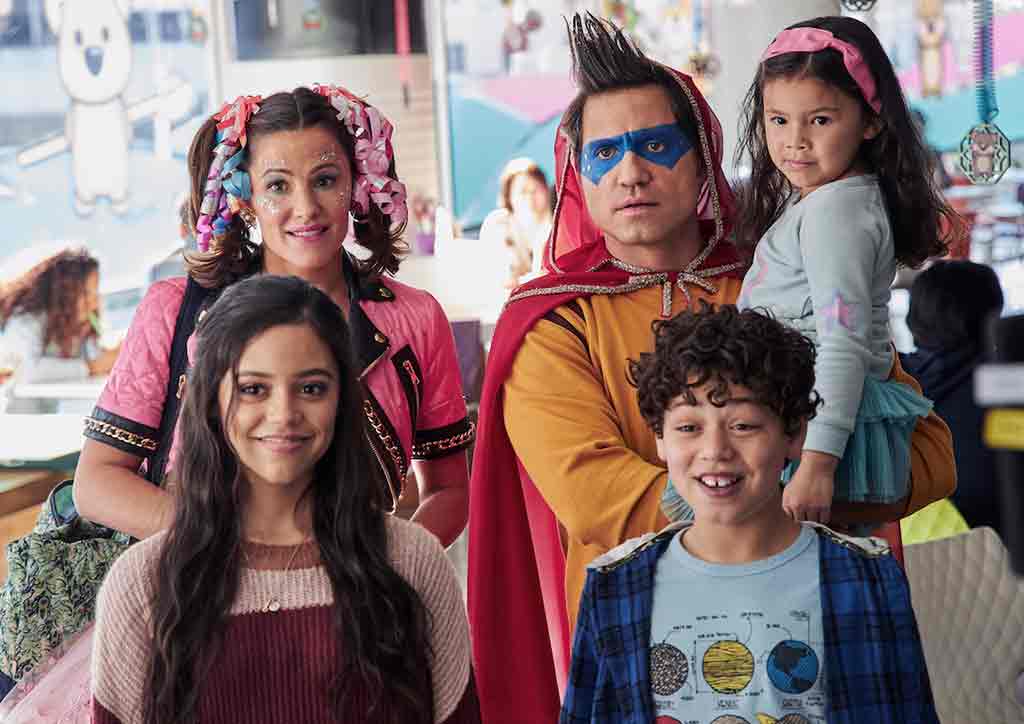 YES DAY summer movie poster with mom and dad wearing costumes with kids. 