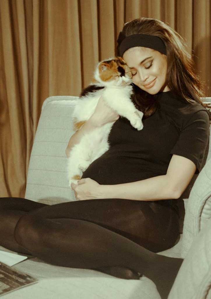 Girl in pink with her dog. 