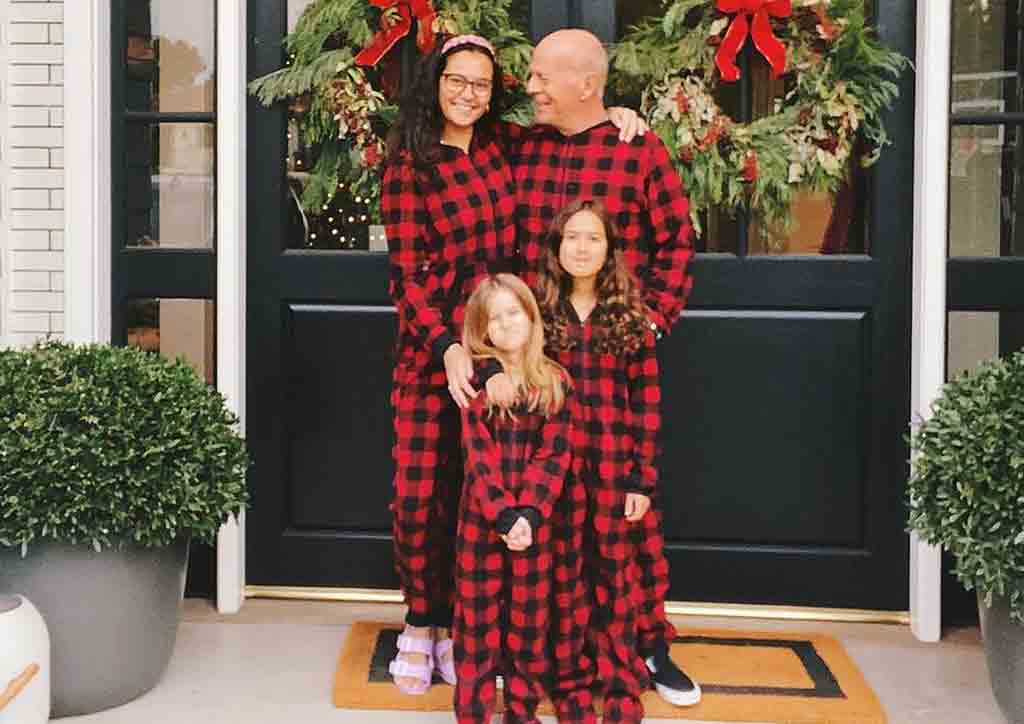 Father poses with family 