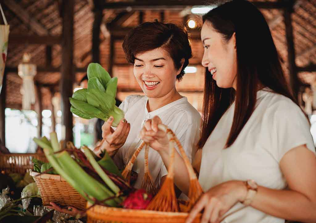 Girls shopping for plant-based meals. 
