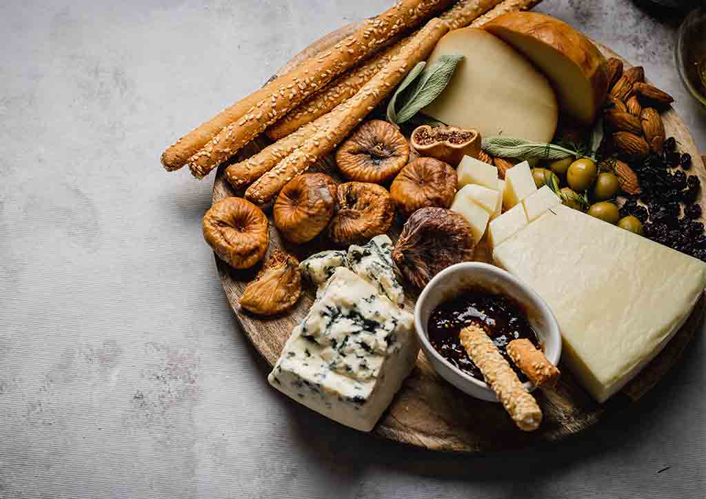 Breads and cheese on a charcuterie board
