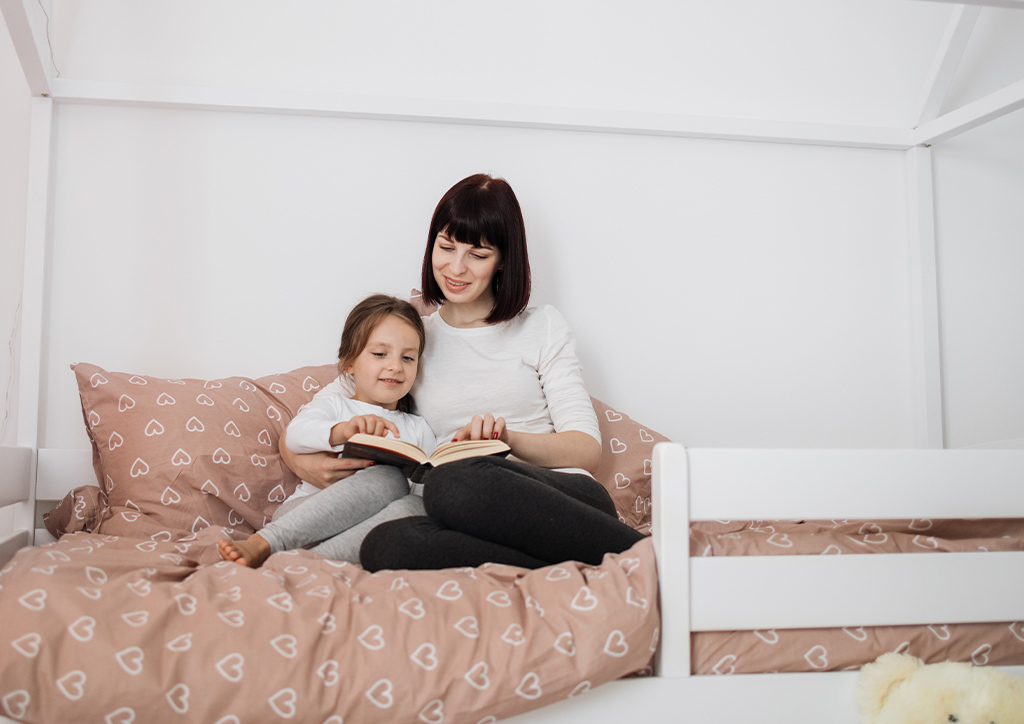 A mother and daughter reading a book