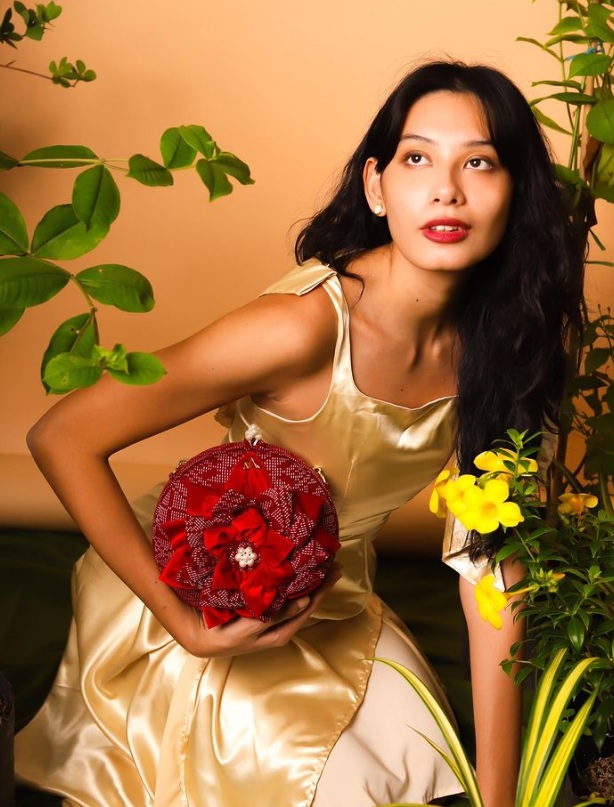 Modern Filipiniana Bag woven in red with pearl and gold hardware.