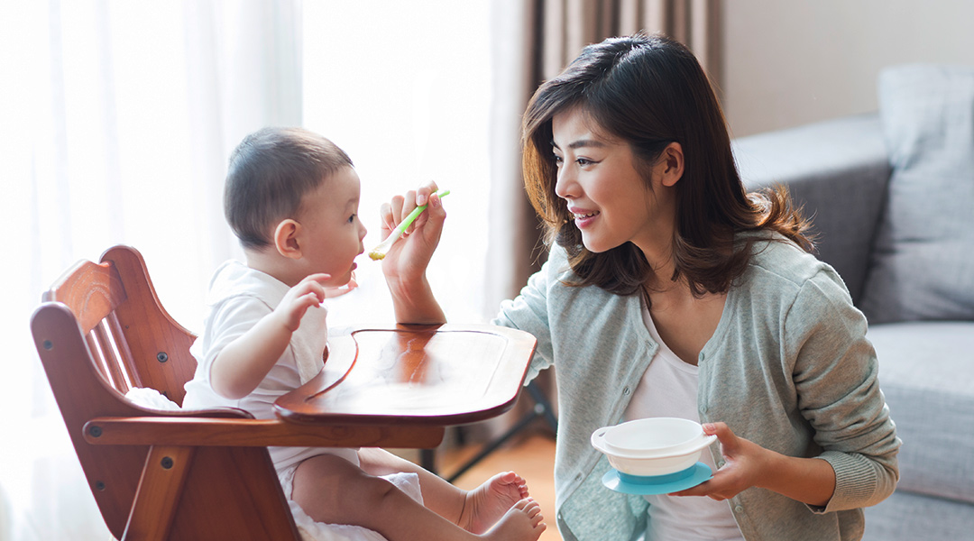 A mom feeding her baby
