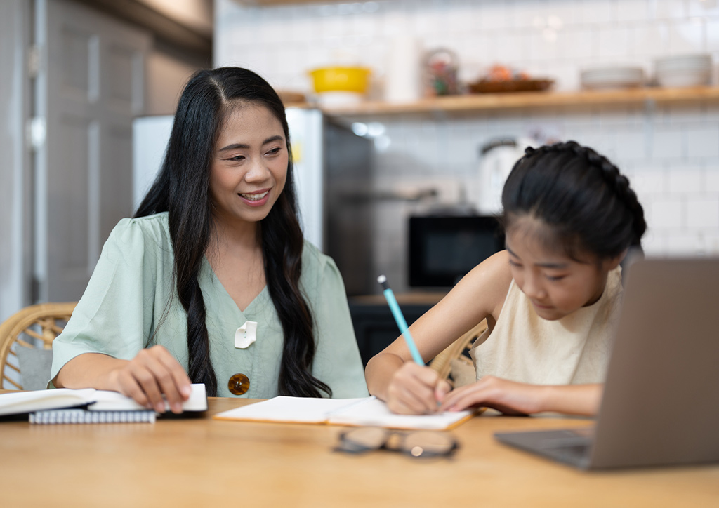 A mother teaching her daughter their Mother Tongue