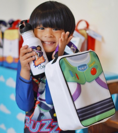 Nikki Gil's son, Finn, is just overjoyed to have his own Toy Story water bottle and bag.