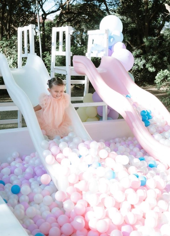 Zoe Miranda enjoying a ball pit slide on her birthday.