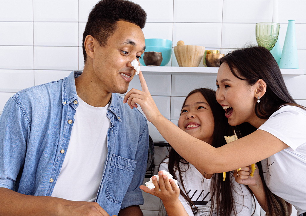 A dad, mom, and their little girl