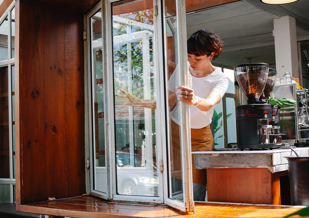 A service worker cleaning the window