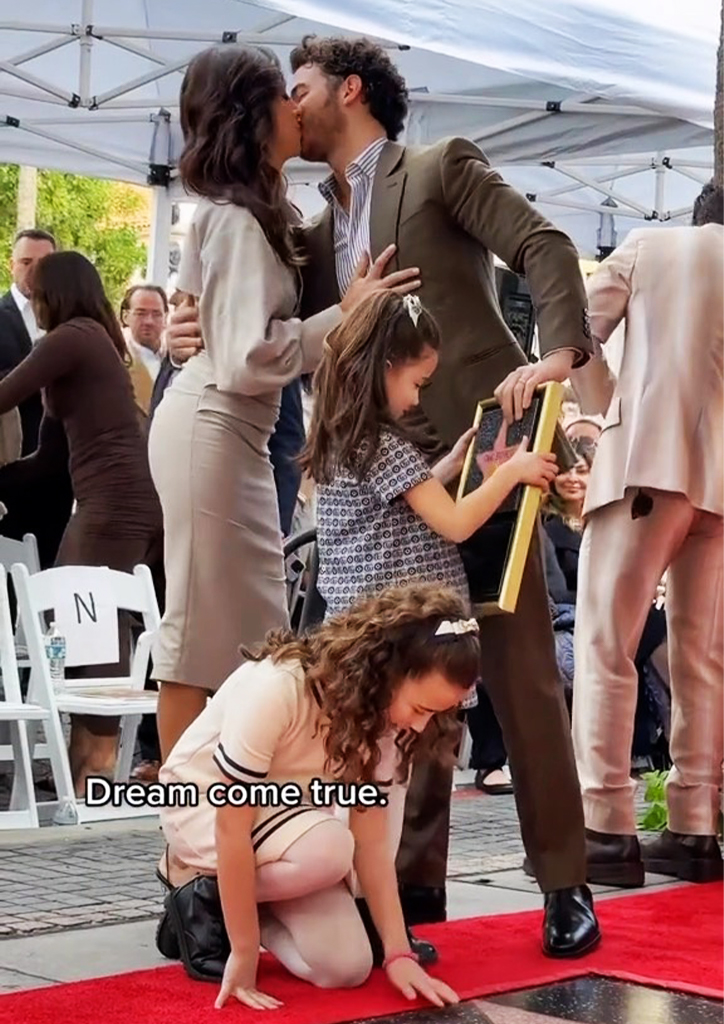 Kevin Jonas with his wife and kids at the Hollywood walk of fame