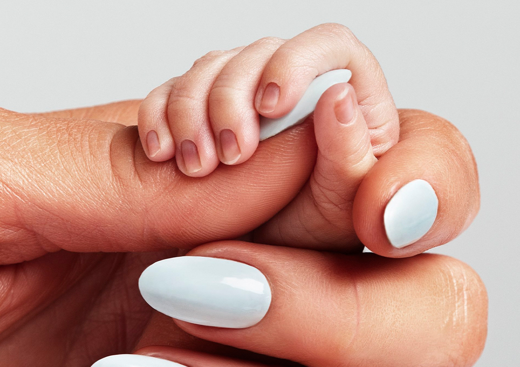 Paris Hilton holding her son's hand