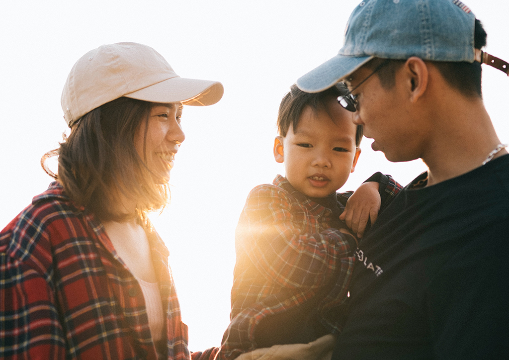 A mom and dad trying to be perfect parents for their son