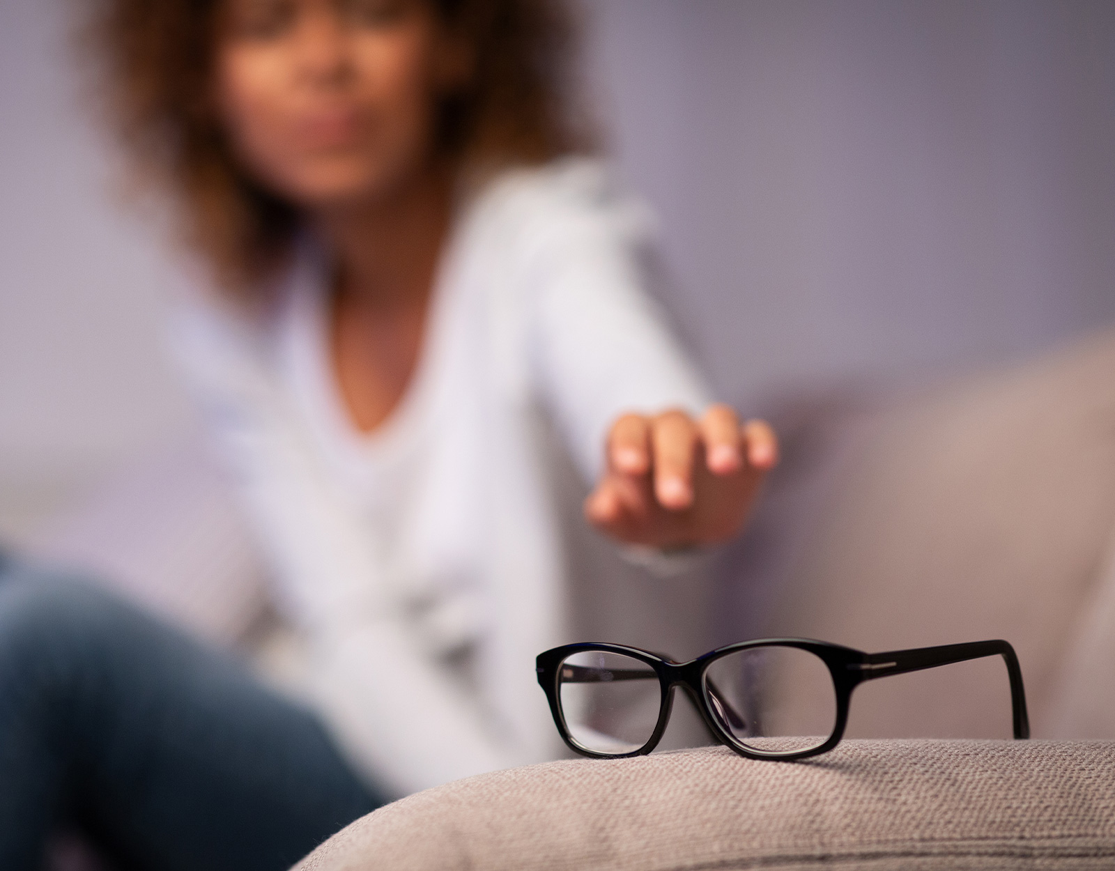 A mom reaching out for her glasses