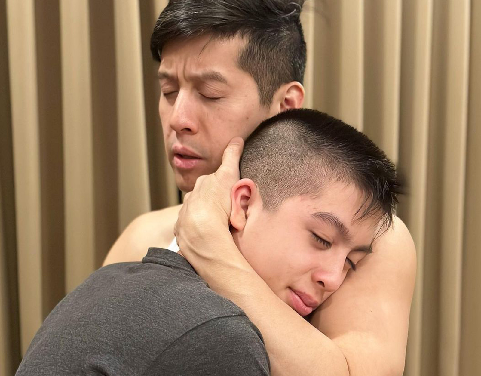 Edric and Edan Mendoza hugging