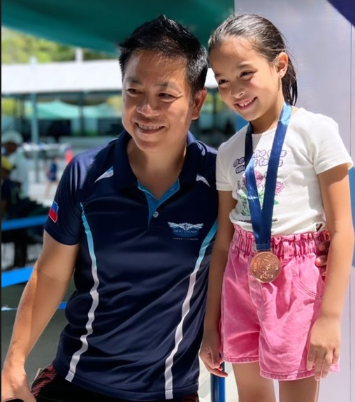 Zia Dantes smiles with her bronze model for swimming