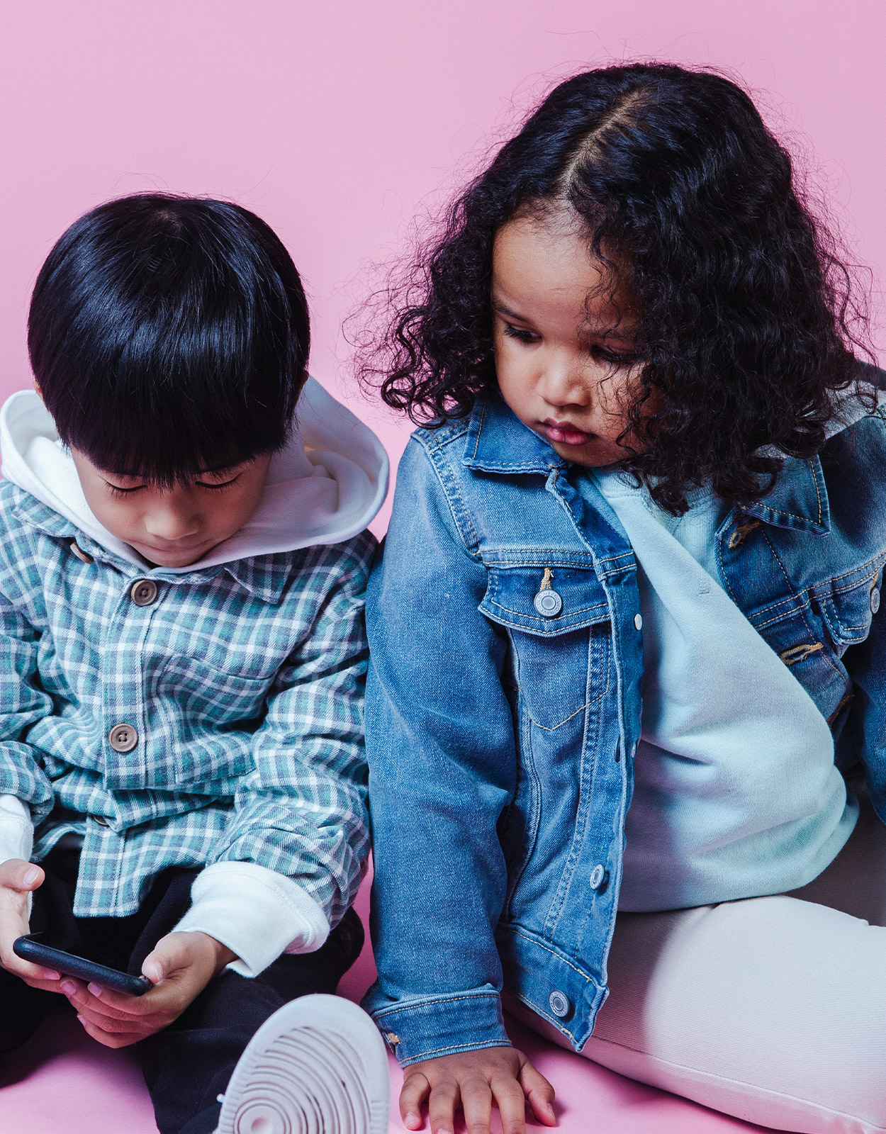 Kids looking at a smartphone