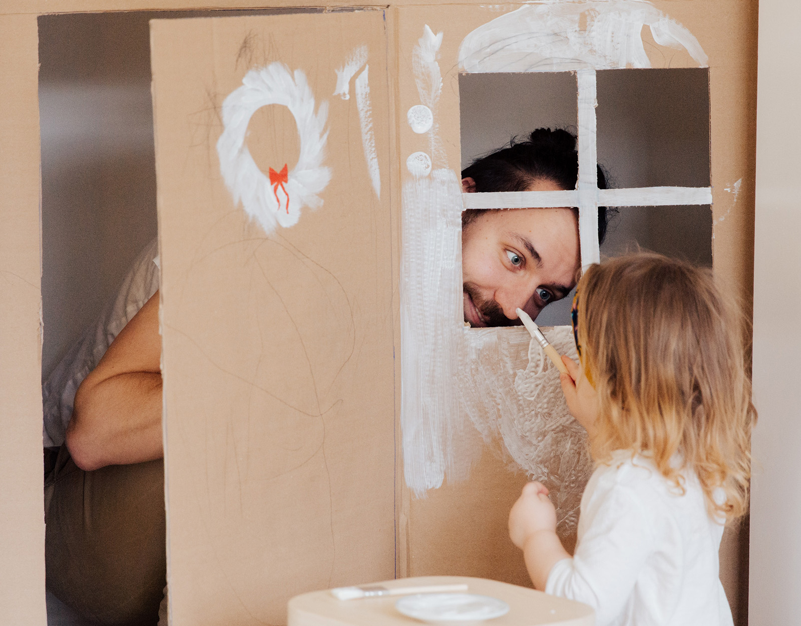 A father playing with his daughter