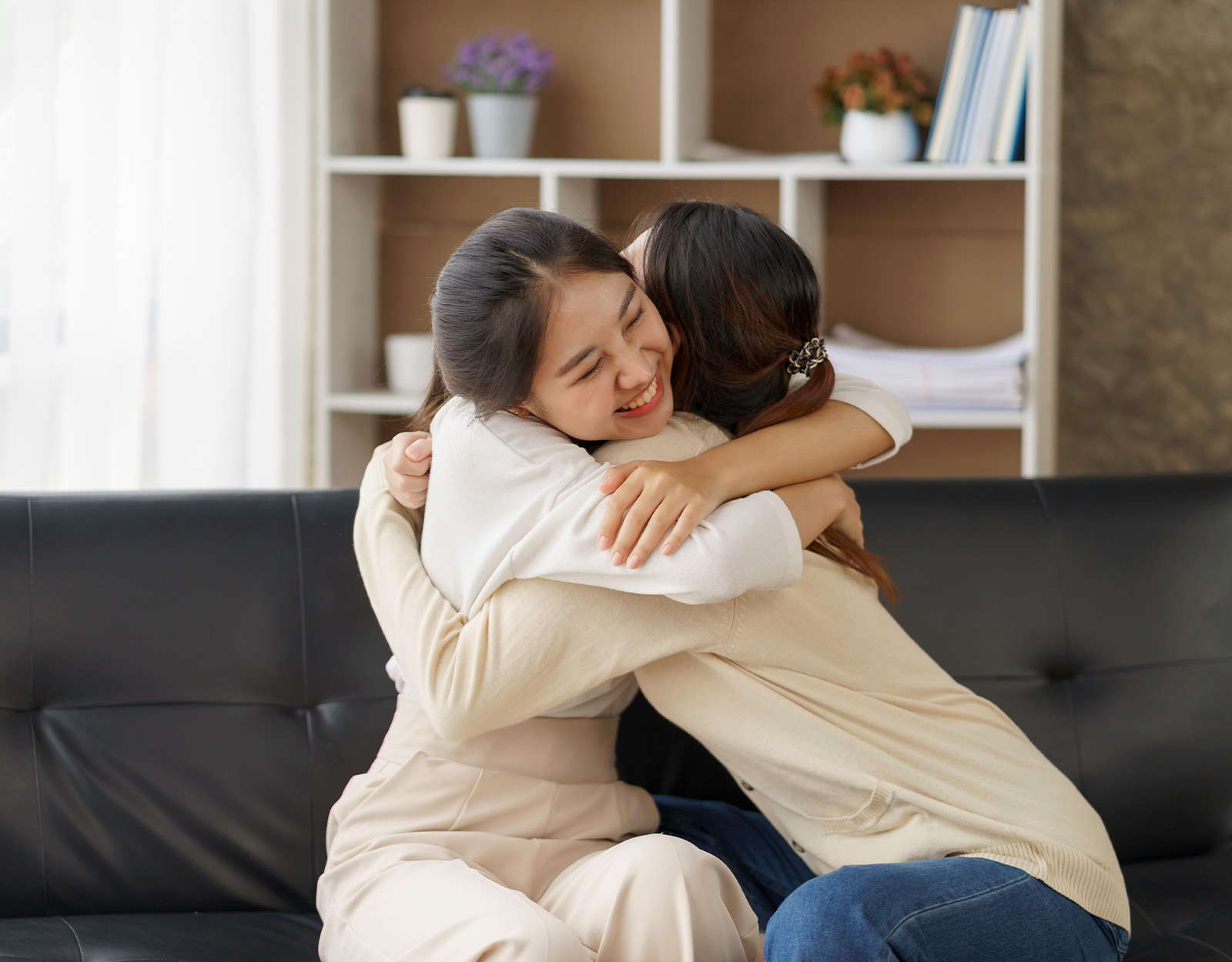 A daughter and mother hugging