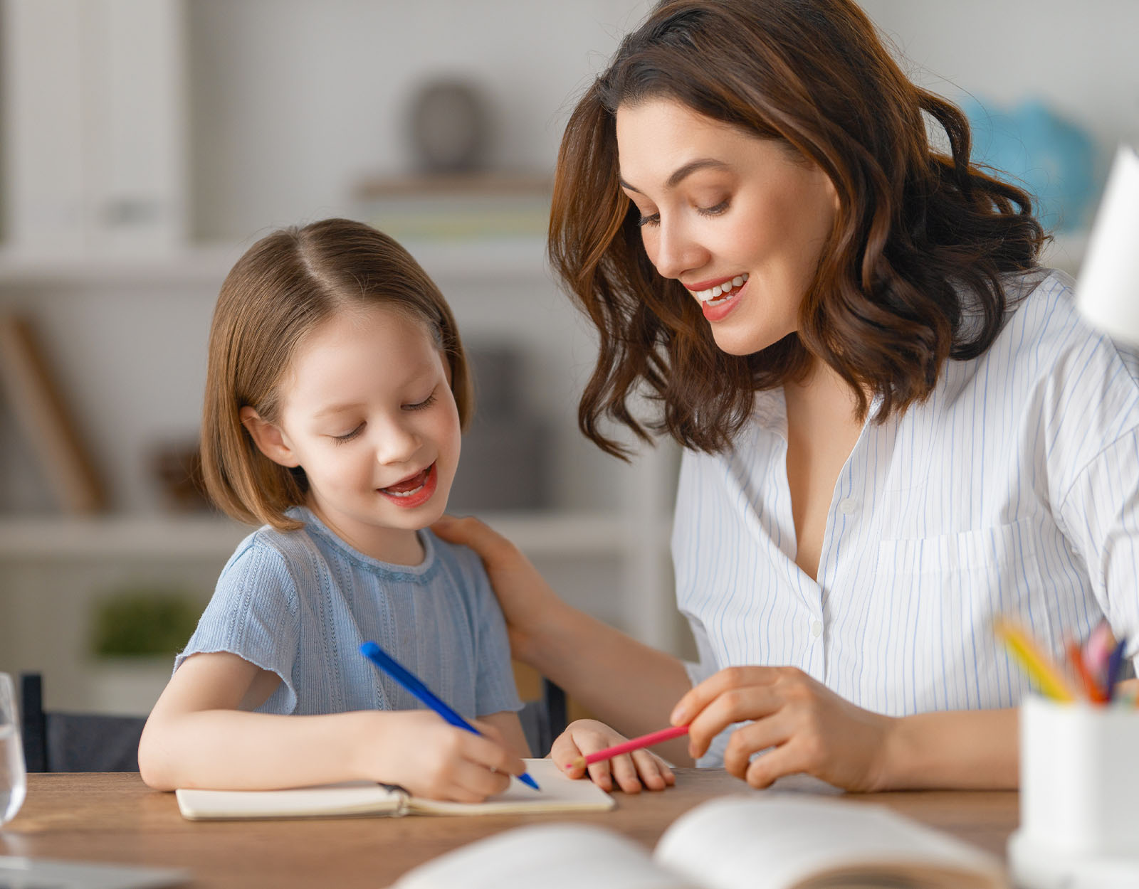 A mother helping her daughter with therapy