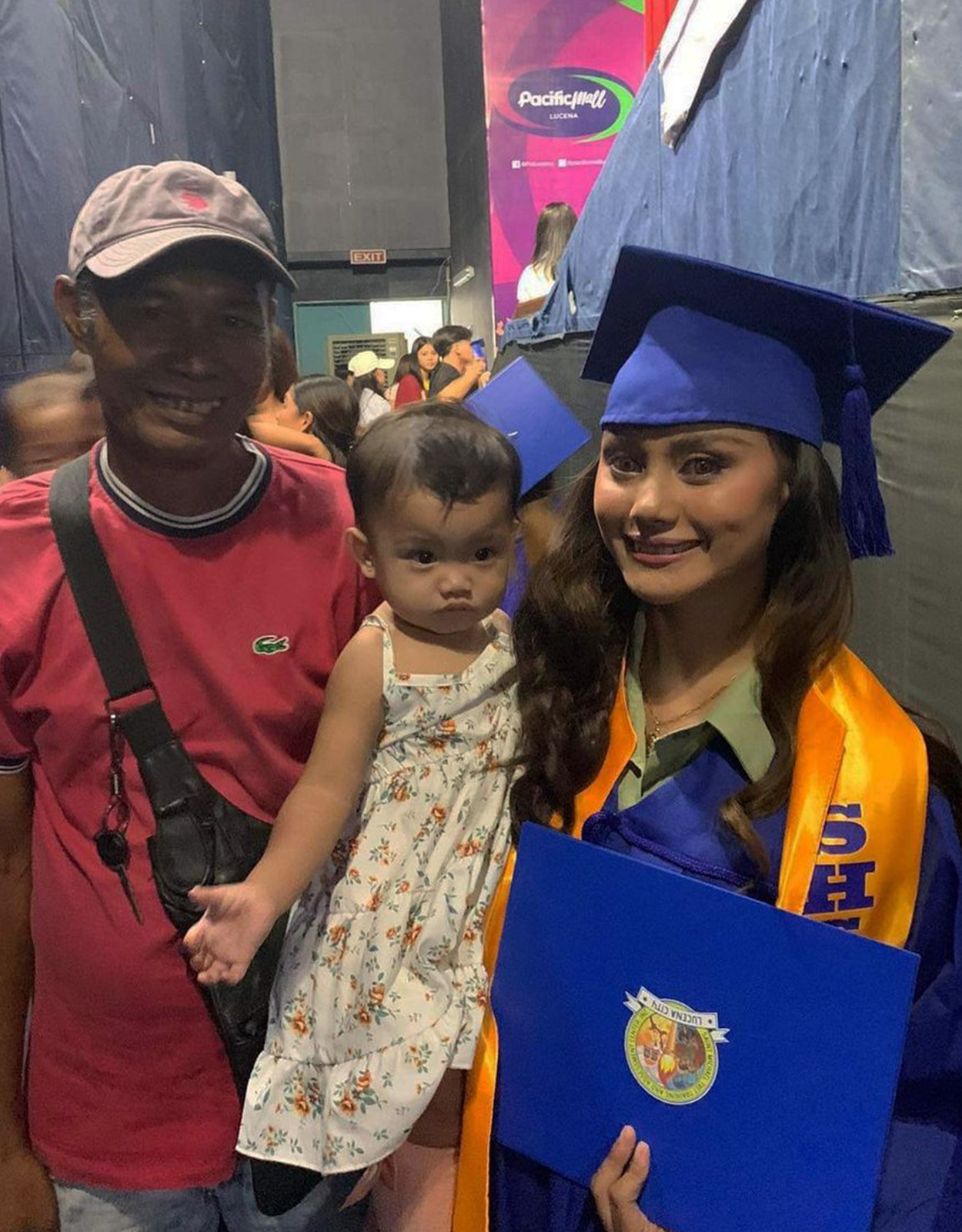 Rita Gaviola graduates and her family supports her