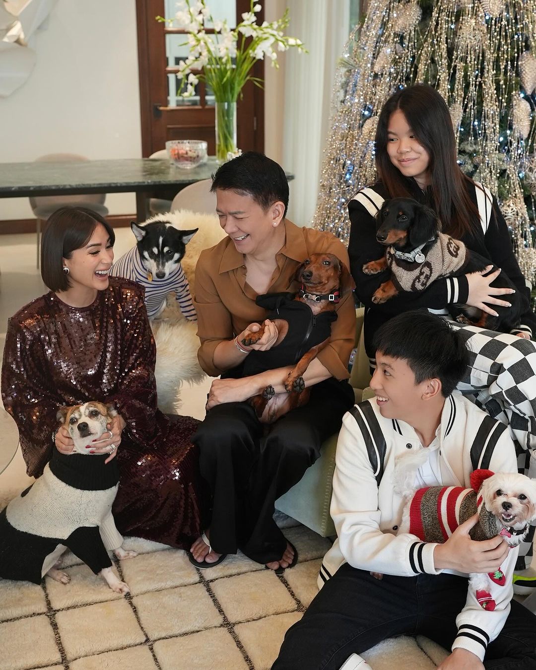 Heart Evangelista, Chiz Escudero, and the twin children: Cecilia and Joaquin laughing and talking together