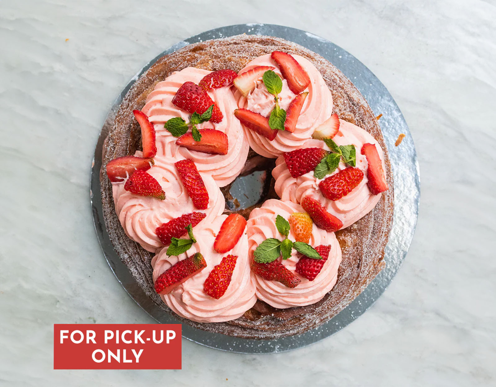 Something more unique for our kid's birthday cake: how about a strawberry cream cronut cake?
