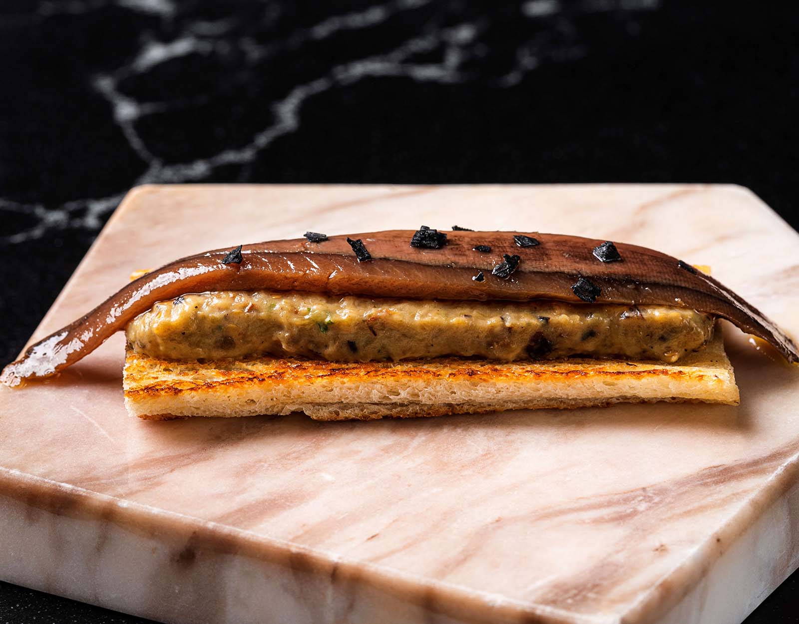 Tosta de Anchoa y Berenjena: Cantabrian premium anchovy baguette toast and charred eggplant
