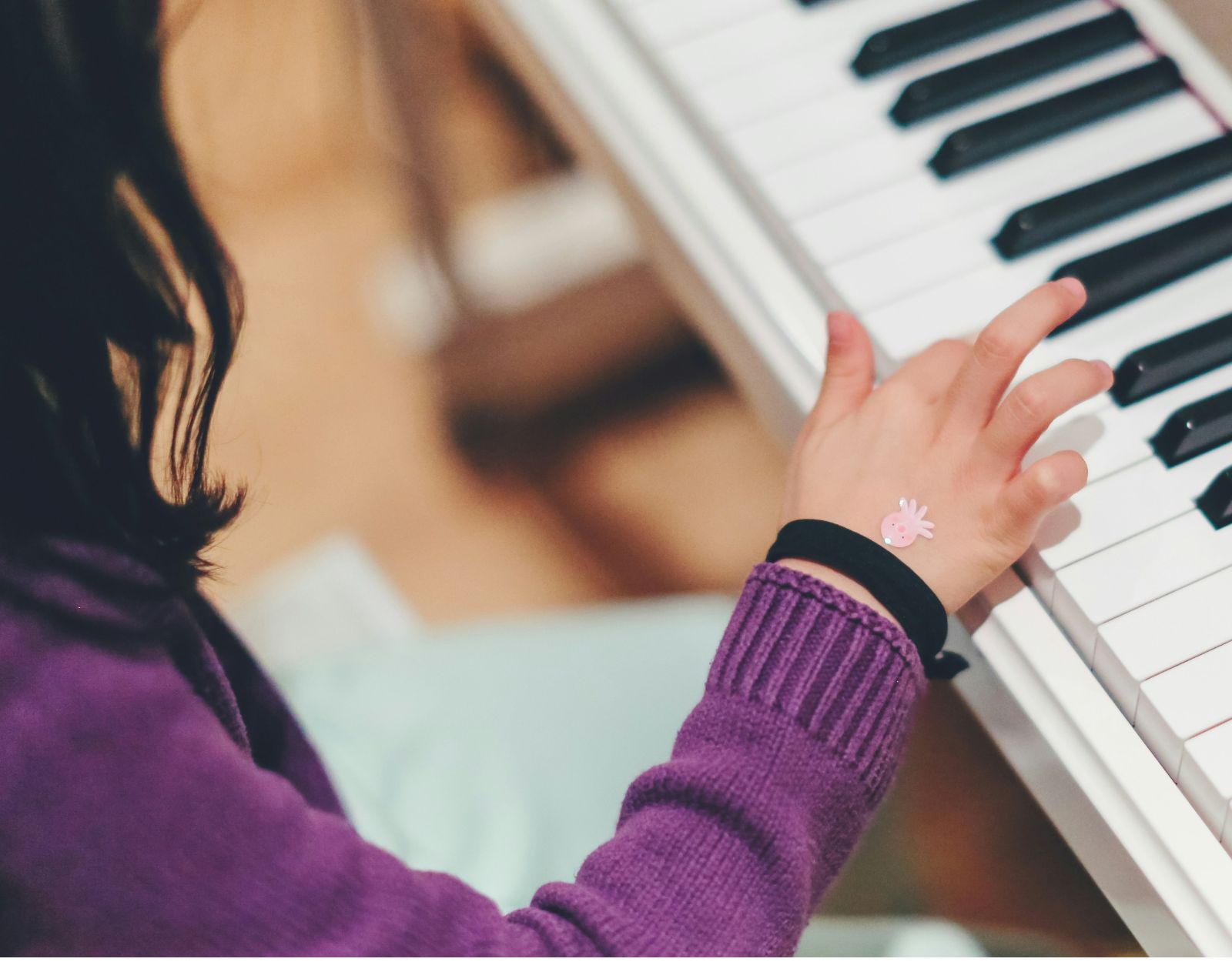 kid playing the piano
