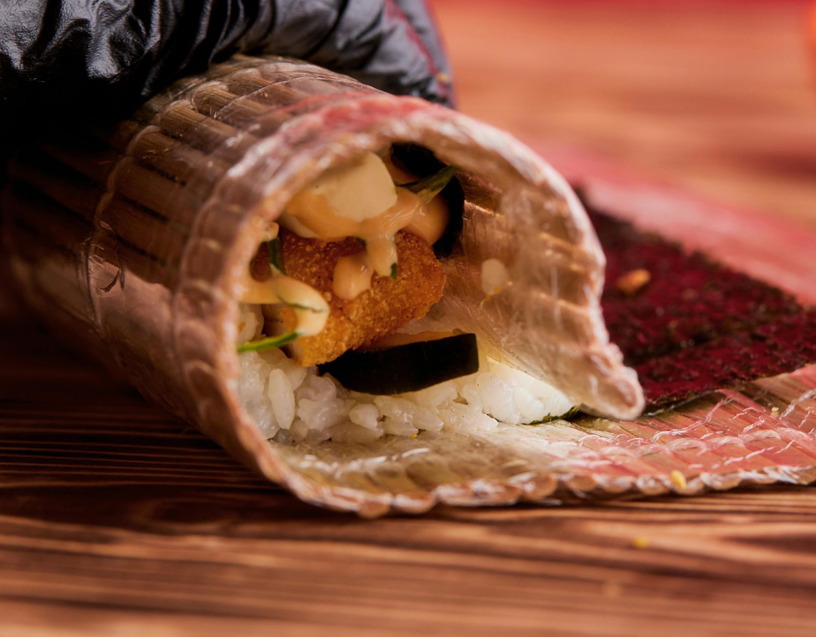 The bamboo mat — every sushi chef's signature tool. Keep it clean by wrapping it in cling wrap so that it can last for days.