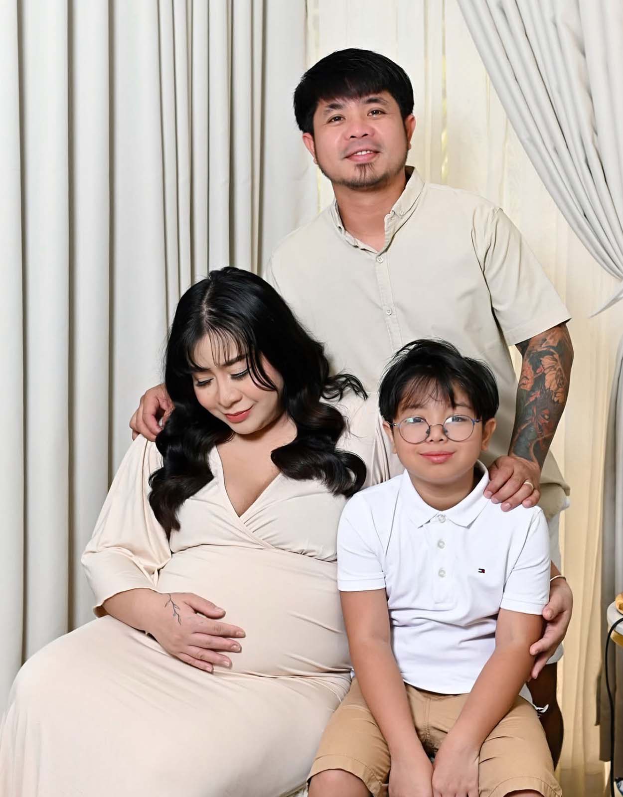 Sarah del Rosario with her husband and son
