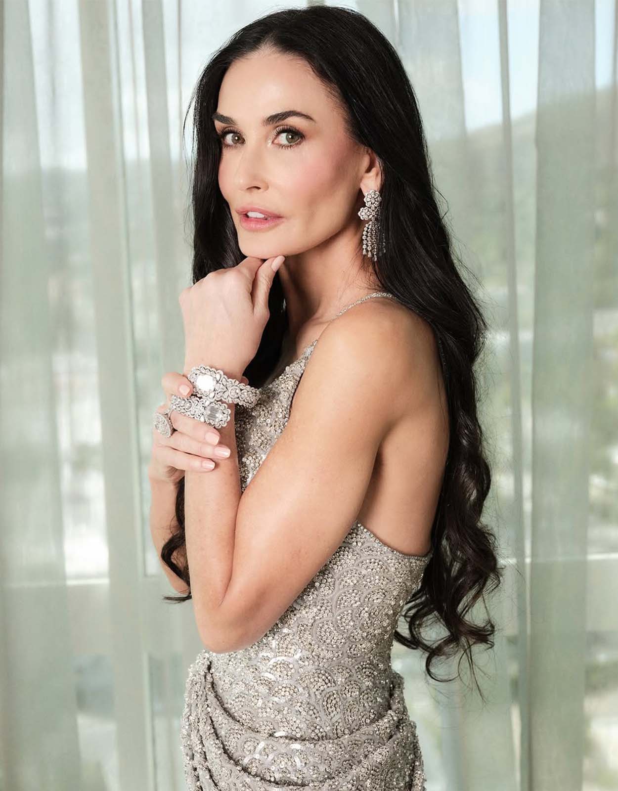 Demi Moore poses before hitting the red carpet