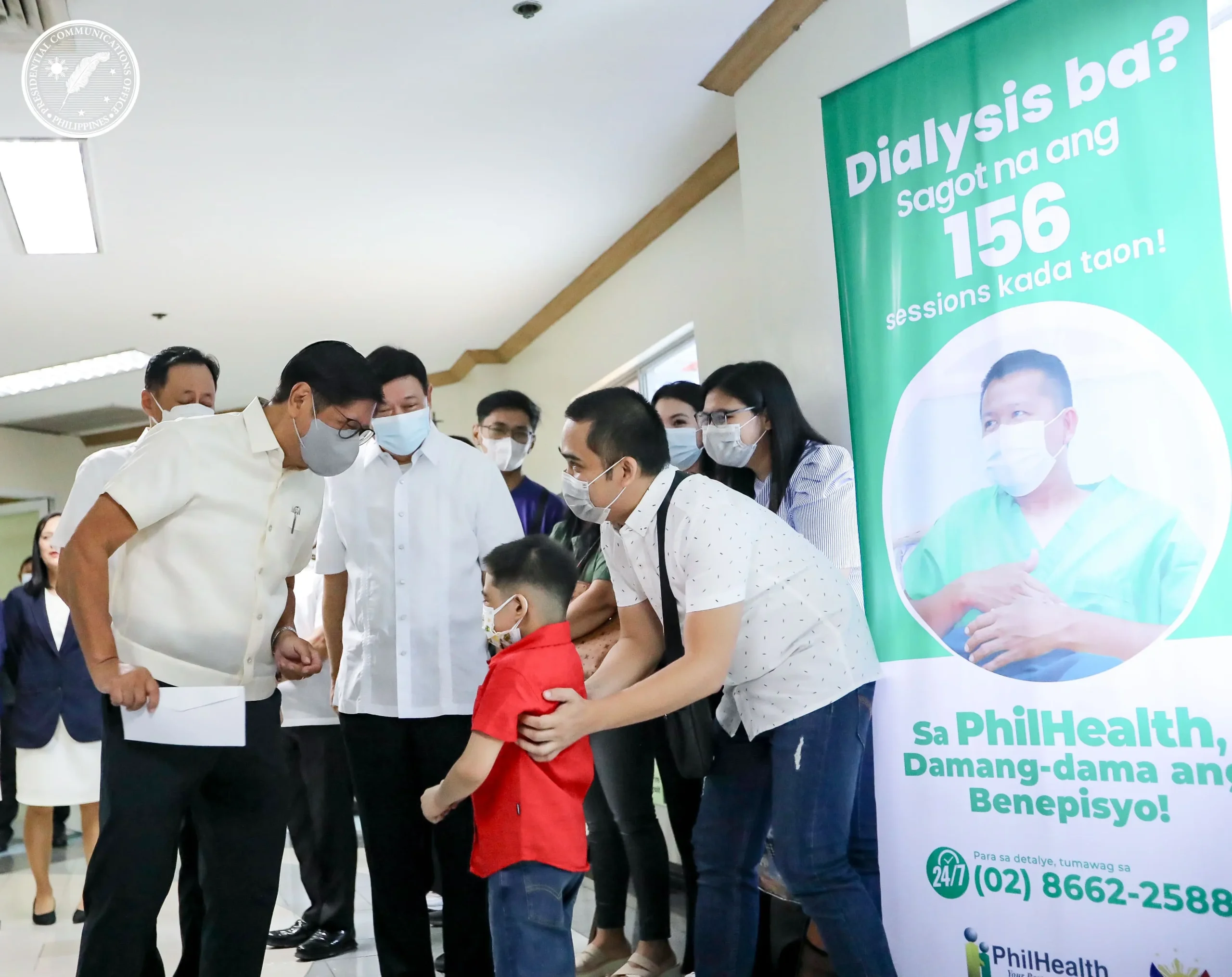 President Marcos speaking to a boy after his kidney transplant.