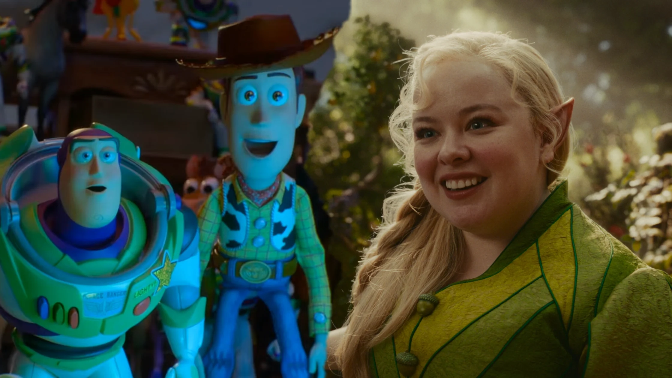 Smiling woman in a yellow-green elf costume poses beside colorful blue toy aliens in a theme-park scene.