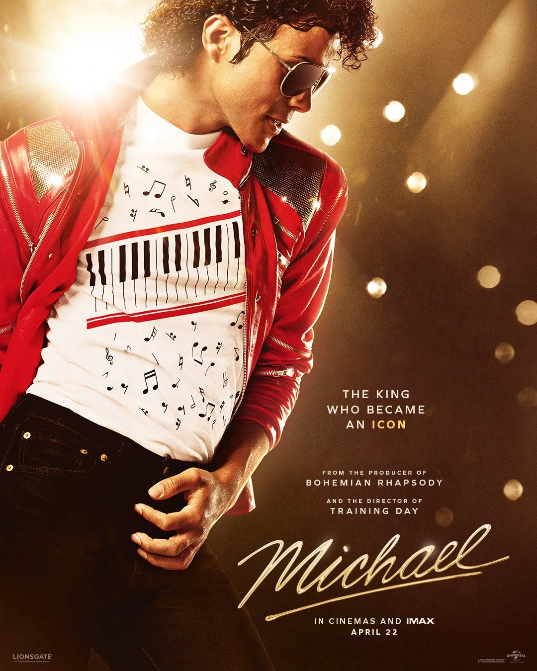 Promotional poster for the film Michael: a singer in a red jacket and sunglasses on stage, wearing a piano-key shirt with bright stage lights in the background.